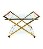 A 1980s Gallotti and Radice “Mister” bar trolley with brass frame and cherry wood handles.