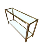 A 1970s Italian solid brass console table with 2 glass shelves