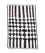 A vintage handmade Beni Ouarian diamond chequerboard and line pattern, Berber rug