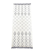 A large handwoven Moroccan Beni Ourain wool berber rug with tribal diamond and line pattern