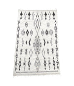 A vintage handwoven Moroccan berber rug, with tribal diamond and line pattern by the Beni Ouarian tribe