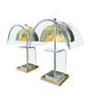 A large unusual pair of 1980s lucite and brass lamps with curved lucite shade and base