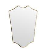 An orignal Italian 1950s brass framed shield mirror with lovely curved shape.