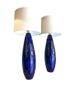 A pair of Italian 1980s large blue ceramic and brass lamps, rewired with with new fittings and linen shades