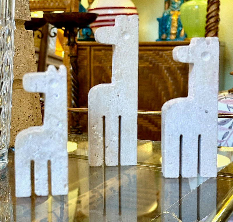 A set of three 1970s Fratelli Mannelli travertine giraffes