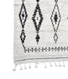 A vintage handwoven Moroccan berber rug, with tribal diamond and line pattern by the Beni Ouarian tribe