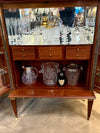 A wonderful 1950s two door bar cabinet by Poalo Buffa with faux malachite panels