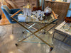 A 1980s Gallotti and Radice “Mister” bar trolley with brass frame and cherry wood handles.