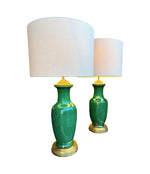 A lovely large pair of 1950s Italian crackle glaze green vase lamps with solid brass bases