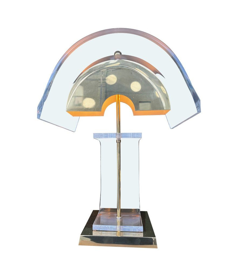 A large unusual pair of 1980s lucite and brass lamps with curved lucite shade and base