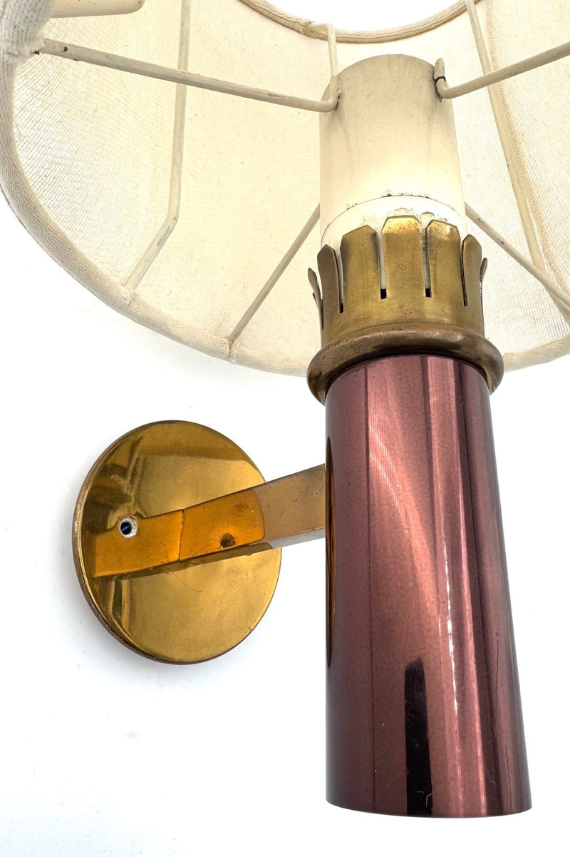 A rare pair of orignal 1960s copper and brass wall sconces by Stilnovo, with orignal labels