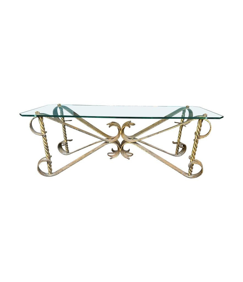 A Spanish 1950s gilt wrought iron coffee table with thick glass top