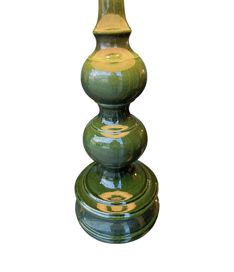 A large French 1960s green glazed ceramic lamp with original hessian shade