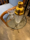 A lovely 1950s Fontana Arte style solid brass tripod martini table with thick glass top