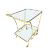 A pretty French 1950s solid brass faux bamboo bar trolley by Maison Baques with two glass shelves