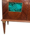 A wonderful 1950s two door bar cabinet by Poalo Buffa with faux malachite panels