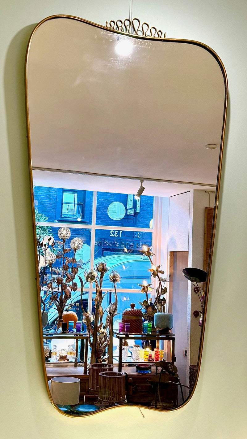 A lovely shaped large original 1950s brass framed mirror in the style of Gio Ponti