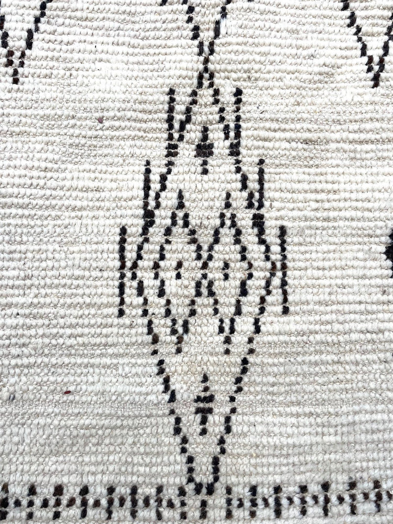 A vintage handwoven Moroccan berber rug, with tribal diamond and line pattern by the Beni Ouarian tribe