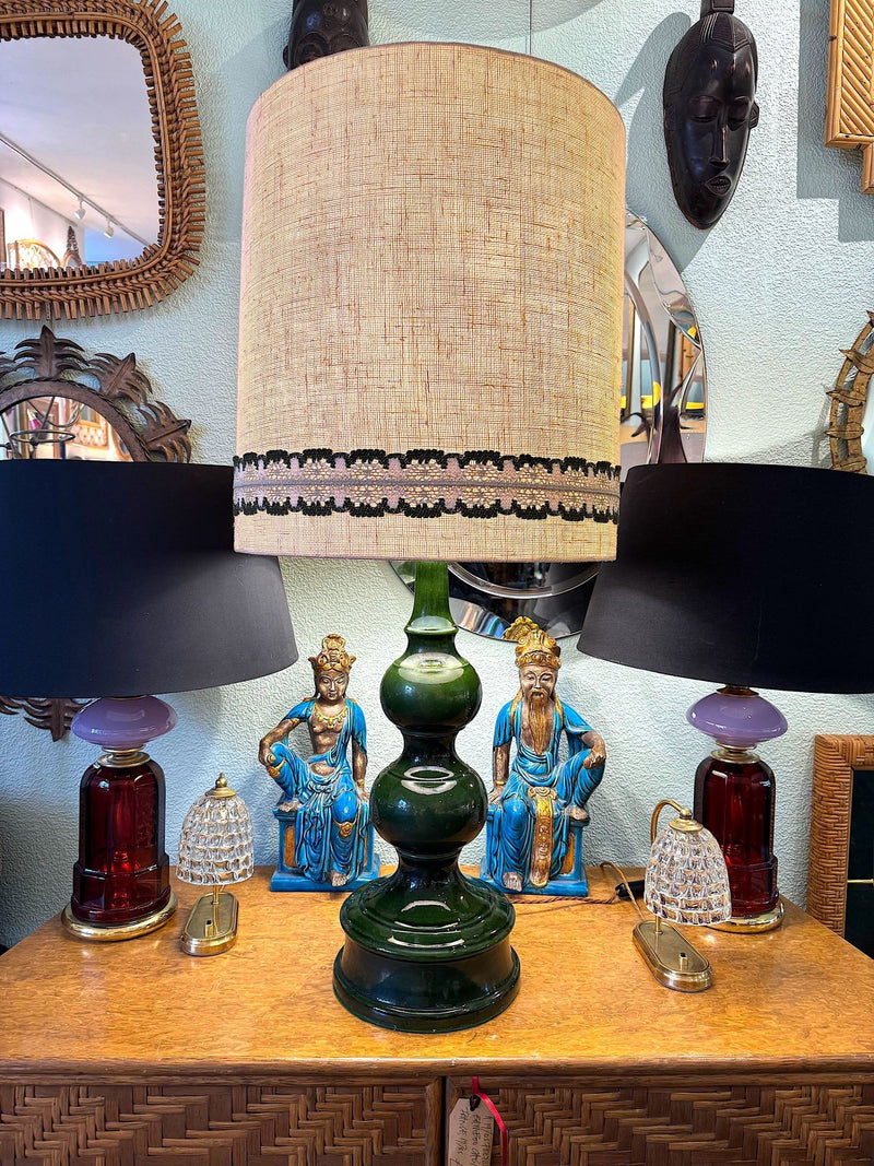 A large French 1960s green glazed ceramic lamp with original hessian shade