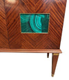 A wonderful 1950s two door bar cabinet by Poalo Buffa with faux malachite panels