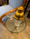 A lovely 1950s Fontana Arte style solid brass tripod martini table with thick glass top