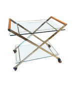 A 1980s Gallotti and Radice “Mister” bar trolley with brass frame and cherry wood handles.