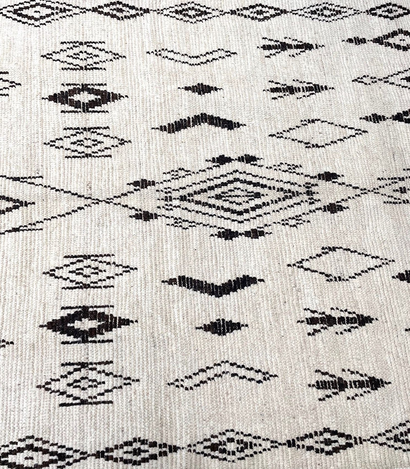 A vintage handwoven Moroccan berber rug, with tribal diamond and line pattern by the Beni Ouarian tribe