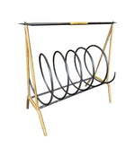 An unusual Italian 1950s mid century brass and black lacquered spiral magazine rack