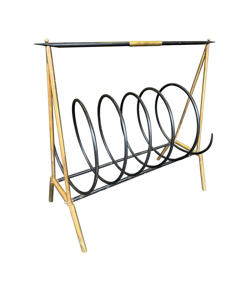 An unusual Italian 1950s mid century brass and black lacquered spiral magazine rack