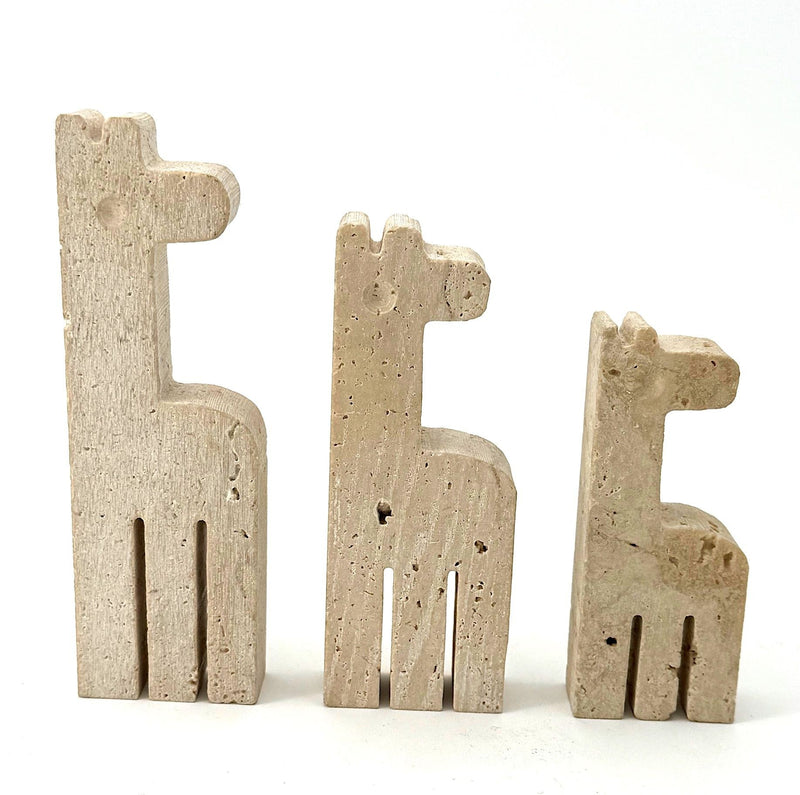 A set of three 1970s Fratelli Mannelli travertine giraffes