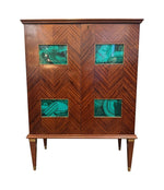 A wonderful 1950s two door bar cabinet by Poalo Buffa with faux malachite panels