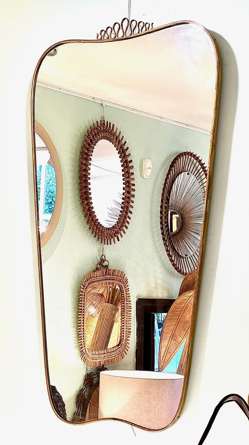 A lovely shaped large original 1950s brass framed mirror in the style of Gio Ponti