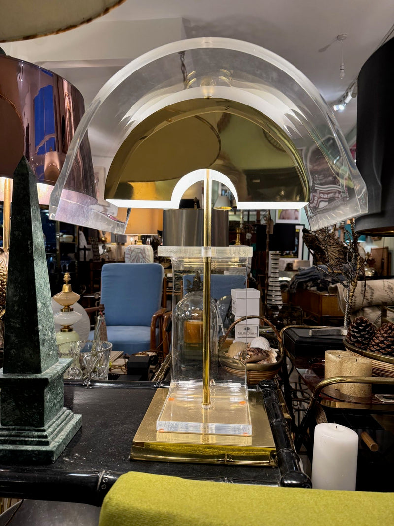 A large unusual pair of 1980s lucite and brass lamps with curved lucite shade and base