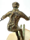 A large pair of bronze cast skiers by Curtis Jere mounted on onyx slabs