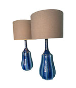 A stunning large pair of 1980s Italian blue and green ceramic lamps with bespoke linen shades