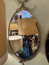 Mid century mirrors Italian oval with brass frame and dolphin detailing.