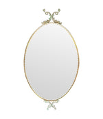 Mid century mirrors Italian oval with brass frame and dolphin detailing.