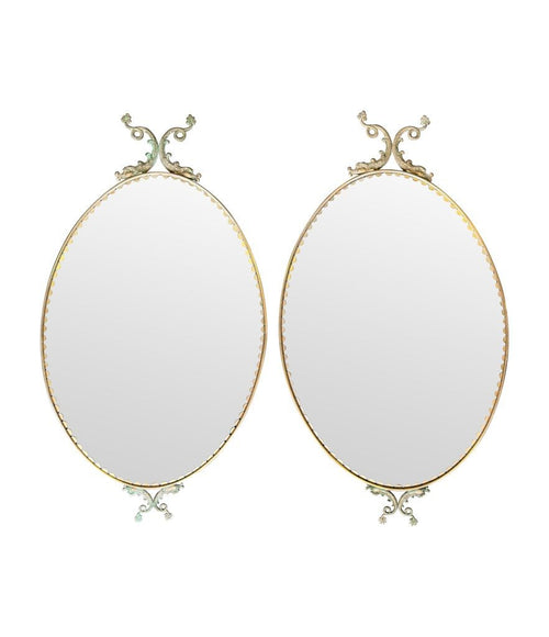 Mid century mirrors Italian oval with brass frame and dolphin detailing.