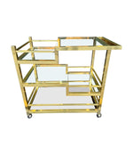 Mid century Romeo Rega Italian gilt metal bar trolley with smoked glass shelves