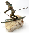 A large pair of bronze cast skiers by Curtis Jere mounted on onyx slabs