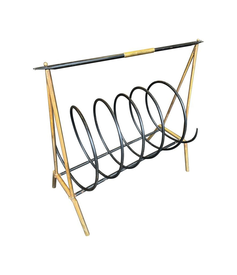 An unusual Italian 1950s mid century brass and black lacquered spiral magazine rack