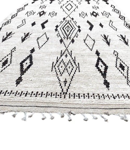 A vintage handwoven Moroccan berber rug, with tribal diamond and line pattern by the Beni Ouarian tribe