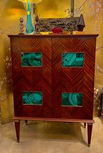 A wonderful 1950s two door bar cabinet by Poalo Buffa with faux malachite panels