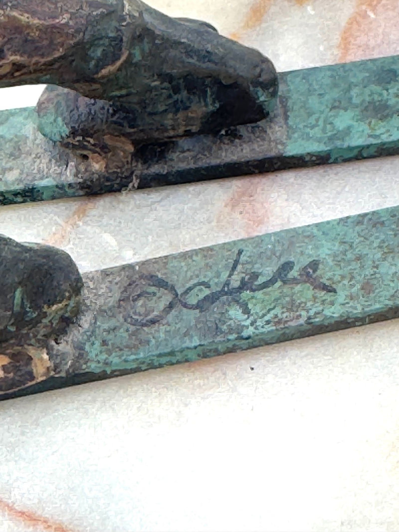 A large pair of bronze cast skiers by Curtis Jere mounted on onyx slabs