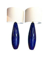 A pair of Italian 1980s large blue ceramic and brass lamps, rewired with with new fittings and linen shades