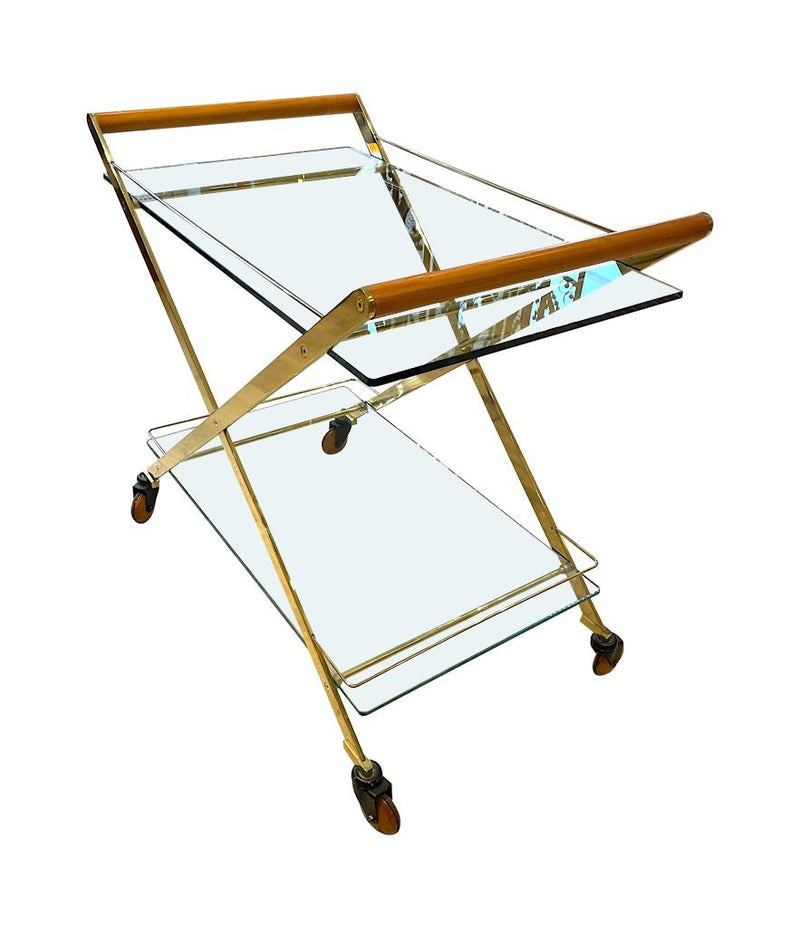 A 1980s Gallotti and Radice “Mister” bar trolley with brass frame and cherry wood handles.