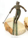 A large pair of bronze cast skiers by Curtis Jere mounted on onyx slabs