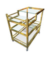 A 1970s Romeo Rega Italian bar trolley with multiple smoked glass shelves