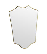 An orignal Italian 1950s brass framed shield mirror with lovely curved shape.