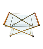 A 1980s Gallotti and Radice “Mister” bar trolley with brass frame and cherry wood handles.